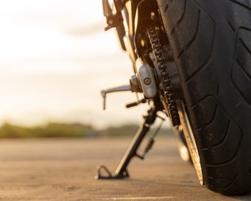 Motorbike parked on the road. A loan was required to make this purchase.